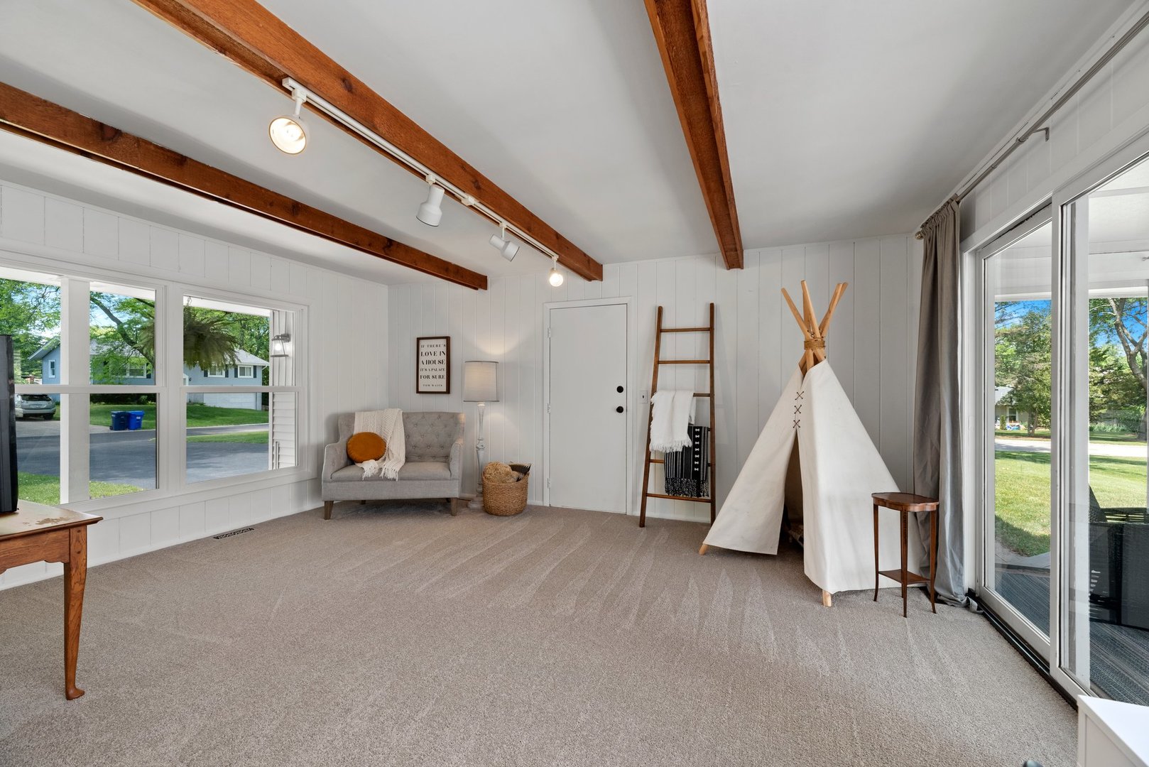 623 Ranch Road Wheaton, IL 60187 - Photo 17 of 21 a view of an empty room with wooden floor and windows