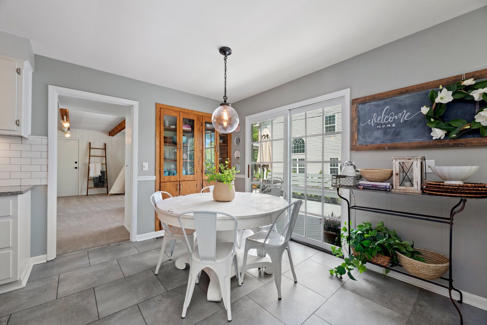 623 Ranch Road Wheaton, IL 60187 - Photo 7 of 21 a view of a dining room with furniture window and outside view