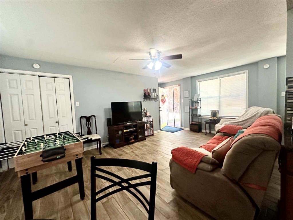 304 Ridgewood Drive Tool, TX 75143 - Photo 4 of 13 a living room with furniture a flat screen tv and a window