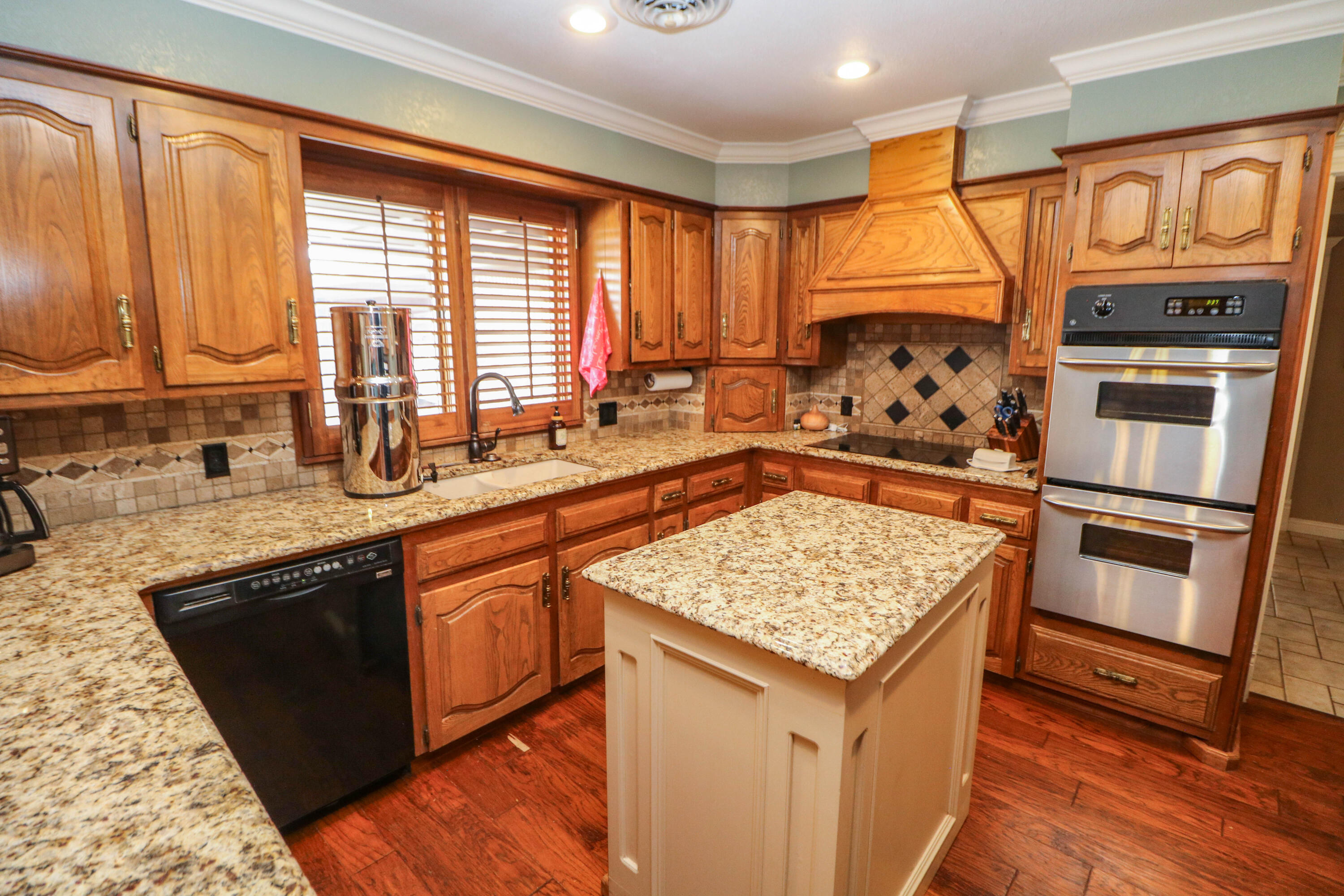1740 Highway 70 Springlake, TX 79082 - Photo 6 of 39 a kitchen with stainless steel appliances granite countertop a stove a sink and a microwave