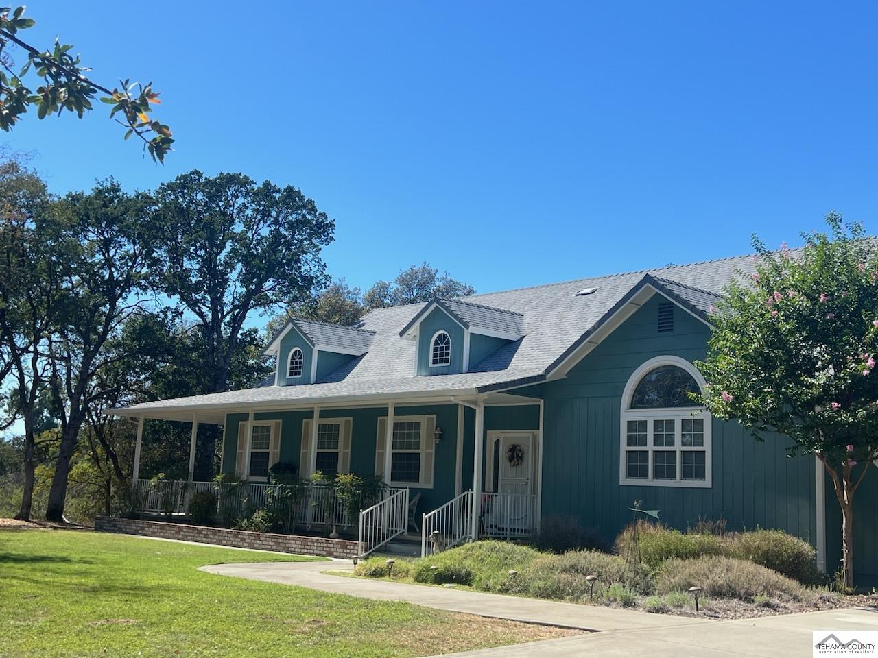 19740 Reeds Creek Road Red Bluff, CA 96080 - Photo 1 of 51 a front view of a house with a garden