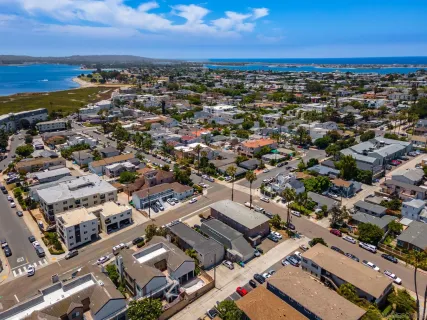 an aerial view of residential building with parking