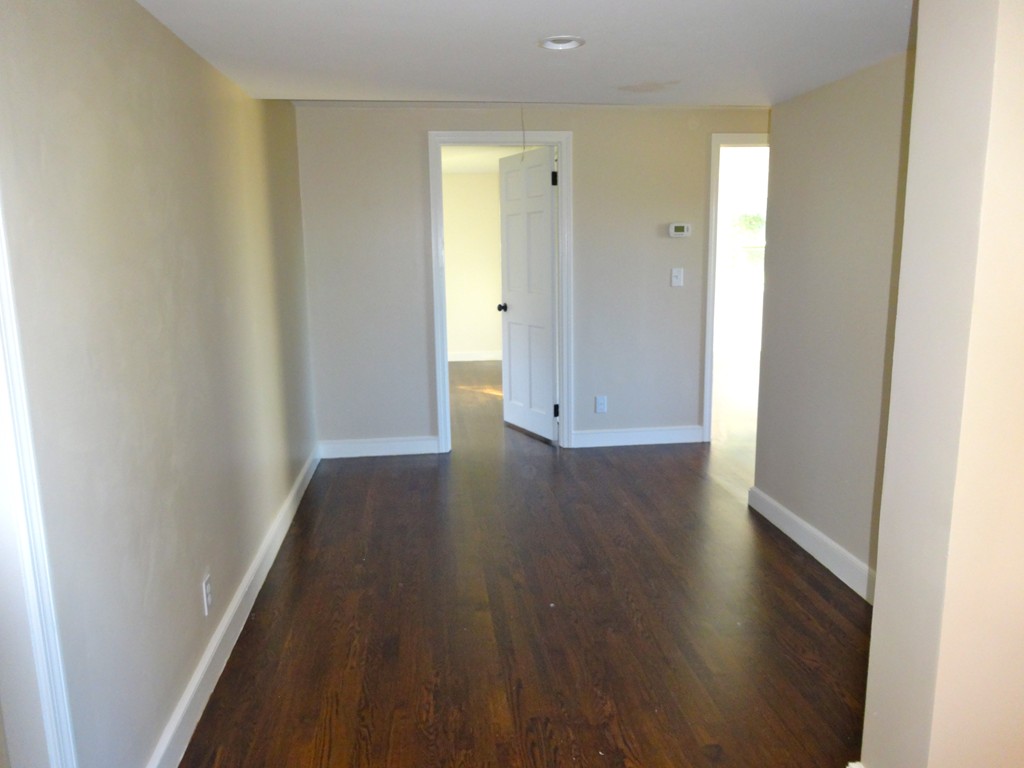 9 Summit Drive Hingham, MA 02043 - Photo 21 of 28 a view of a hallway with wooden floor