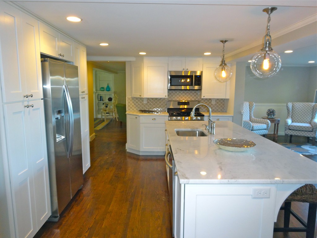 9 Summit Drive Hingham, MA 02043 - Photo 3 of 28 a kitchen with stainless steel appliances granite countertop a sink a refrigerator and a stove