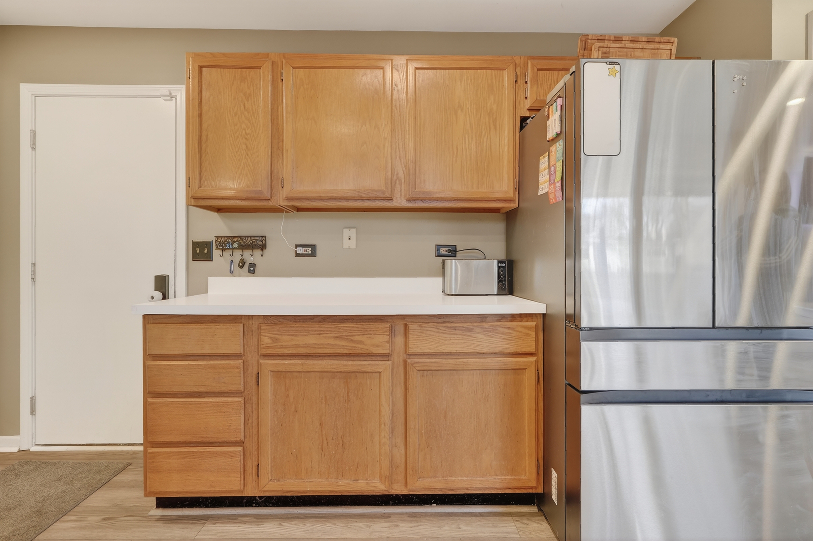 771 Eletson Drive Crystal Lake, IL 60014 - Photo 12 of 32 a kitchen with a refrigerator and cabinets