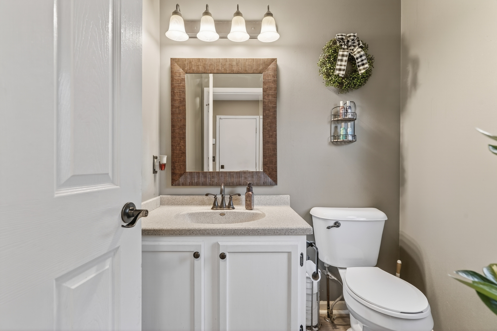 771 Eletson Drive Crystal Lake, IL 60014 - Photo 13 of 32 a bathroom with a granite countertop toilet sink and mirror
