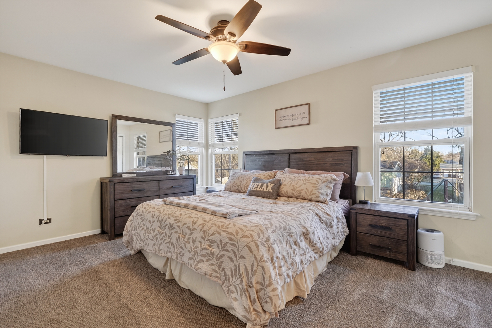 771 Eletson Drive Crystal Lake, IL 60014 - Photo 15 of 32 a spacious bedroom with a bed and a flat screen tv