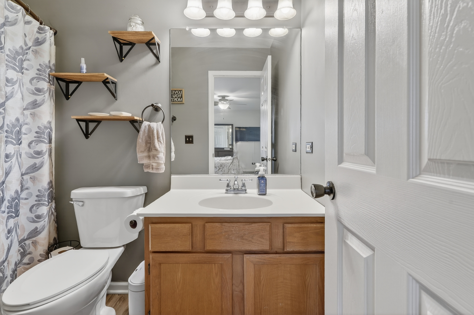 771 Eletson Drive Crystal Lake, IL 60014 - Photo 17 of 32 a bathroom with a sink vanity mirror and toilet
