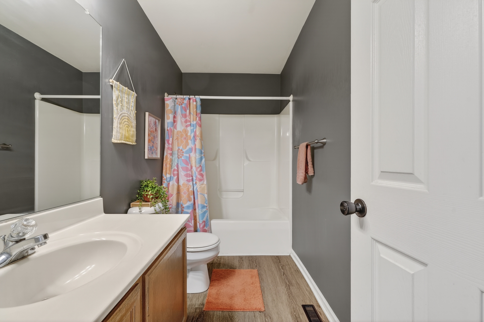 771 Eletson Drive Crystal Lake, IL 60014 - Photo 20 of 32 a bathroom with a sink a toilet and shower