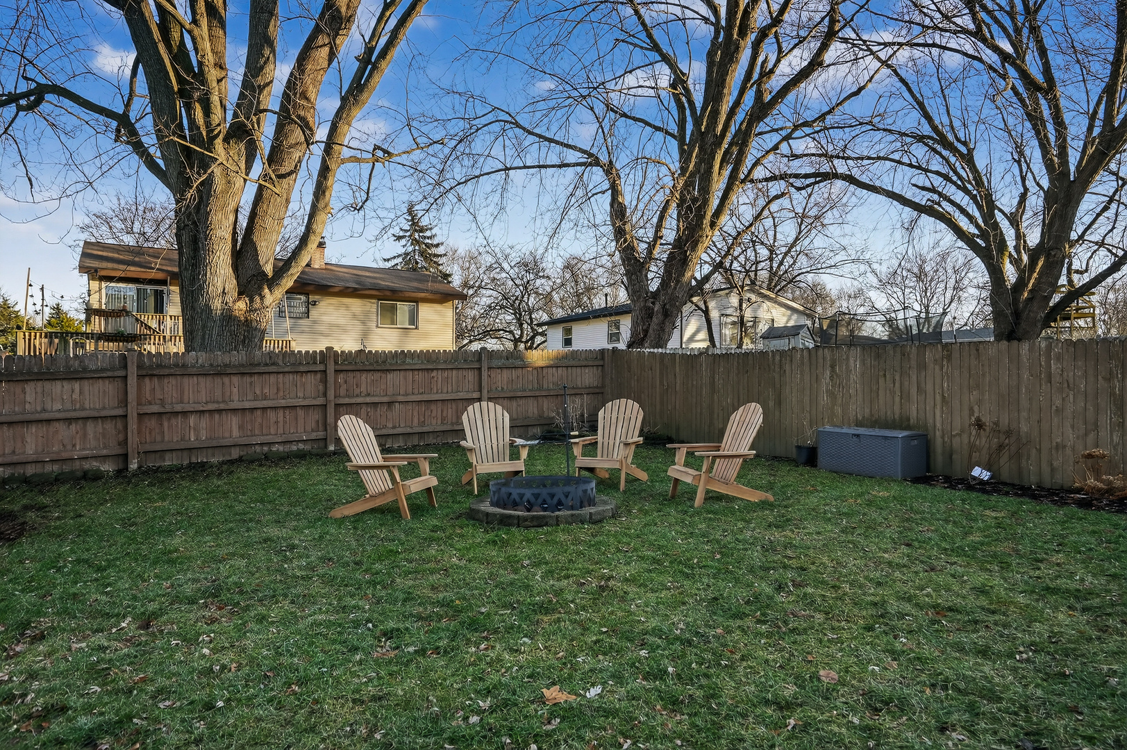 771 Eletson Drive Crystal Lake, IL 60014 - Photo 27 of 32 a view of a backyard with table and chairs and a fire pit