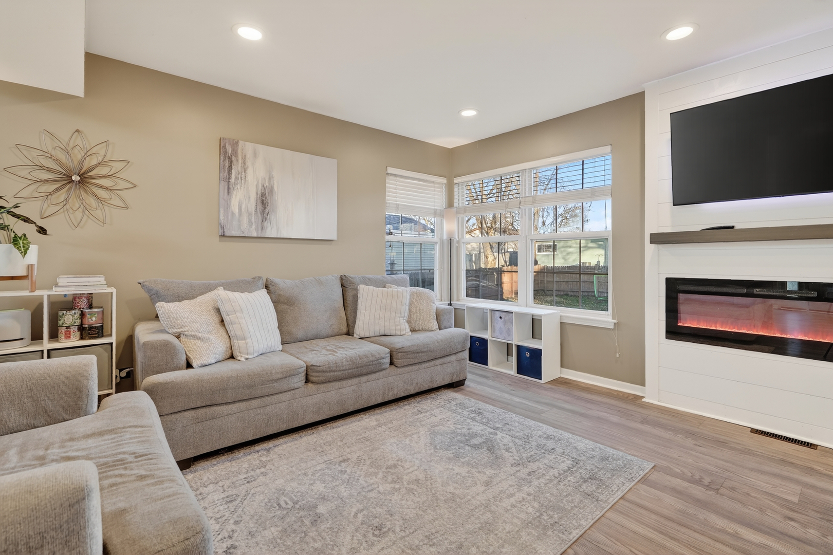 771 Eletson Drive Crystal Lake, IL 60014 - Photo 6 of 32 a living room with furniture and a flat screen tv