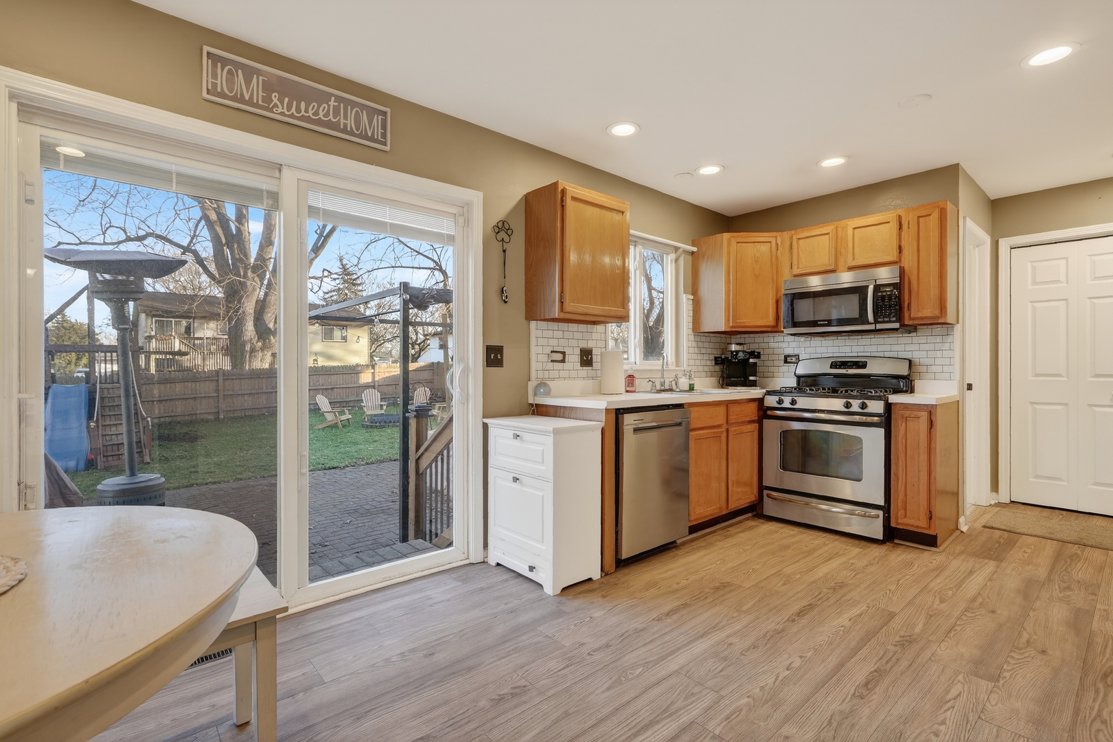 771 Eletson Drive Crystal Lake, IL 60014 - Photo 7 of 32 a kitchen with stainless steel appliances granite countertop a stove a sink and a refrigerator