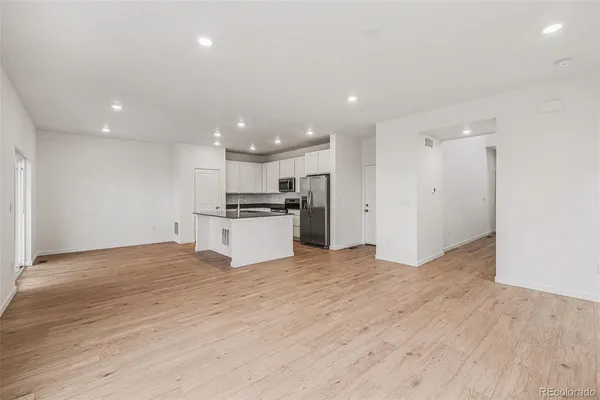 a view of kitchen with wooden floor