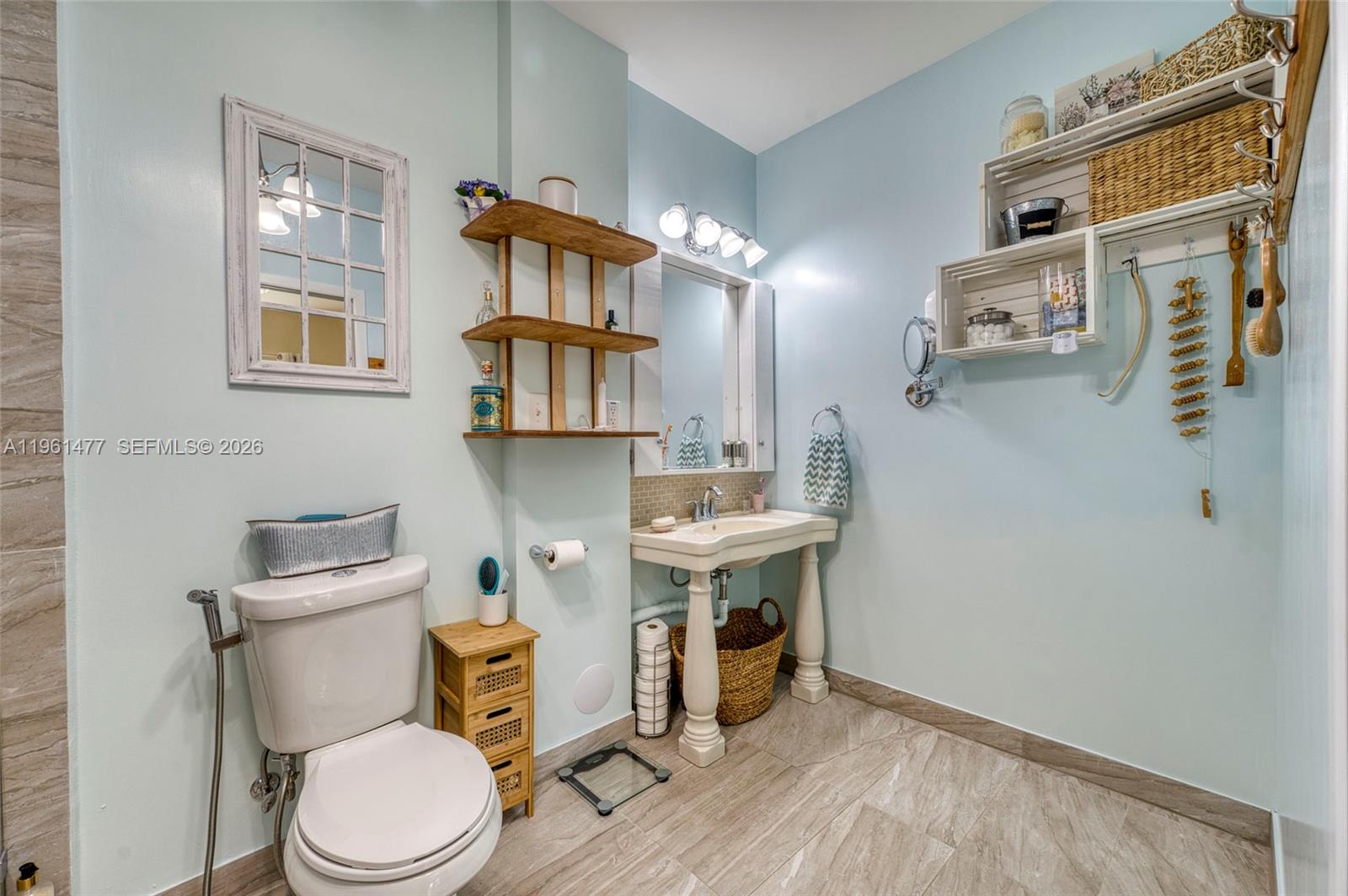 18860 Southwest 354th Terrace Homestead, FL 33034 - Photo 30 of 54 a bathroom with a toilet a sink and a mirror