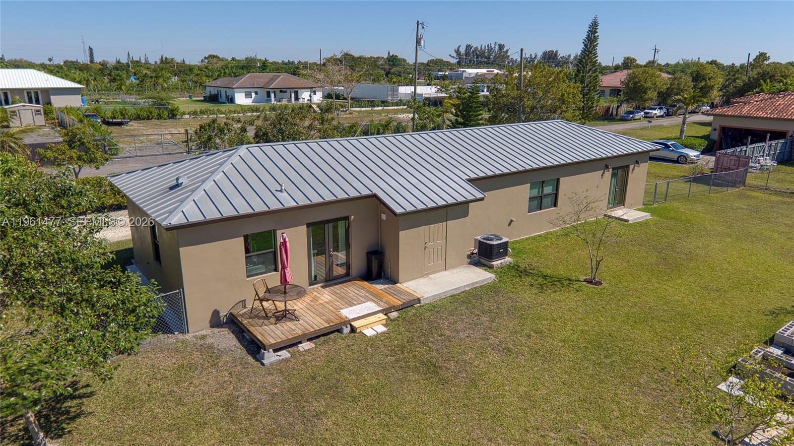 18860 Southwest 354th Terrace Homestead, FL 33034 - Photo 49 of 54 an aerial view of a house with table and chairs