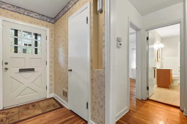 a view of room with window and wooden floor