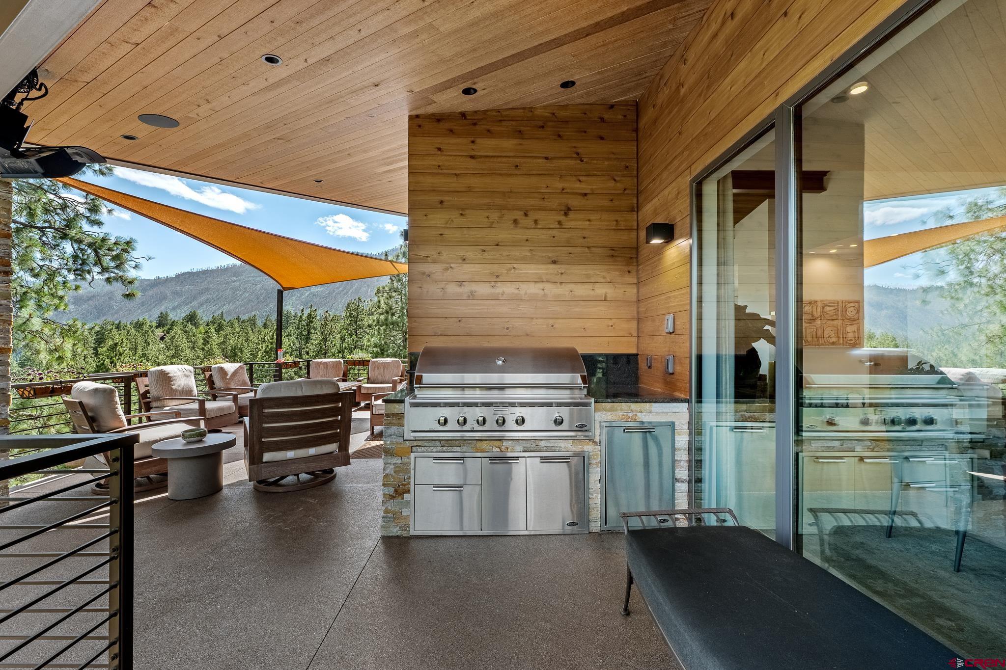 220 Hideout Trail Durango, CO 81301 - Photo 12 of 35 a kitchen with stainless steel appliances a stove and cabinets