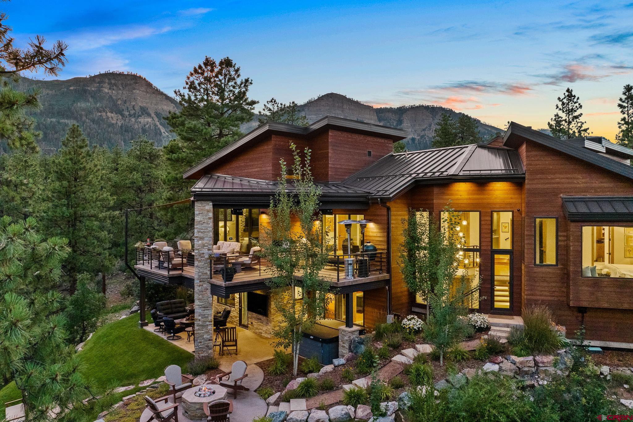 220 Hideout Trail Durango, CO 81301 - Photo 2 of 35 a front view of a house with garden