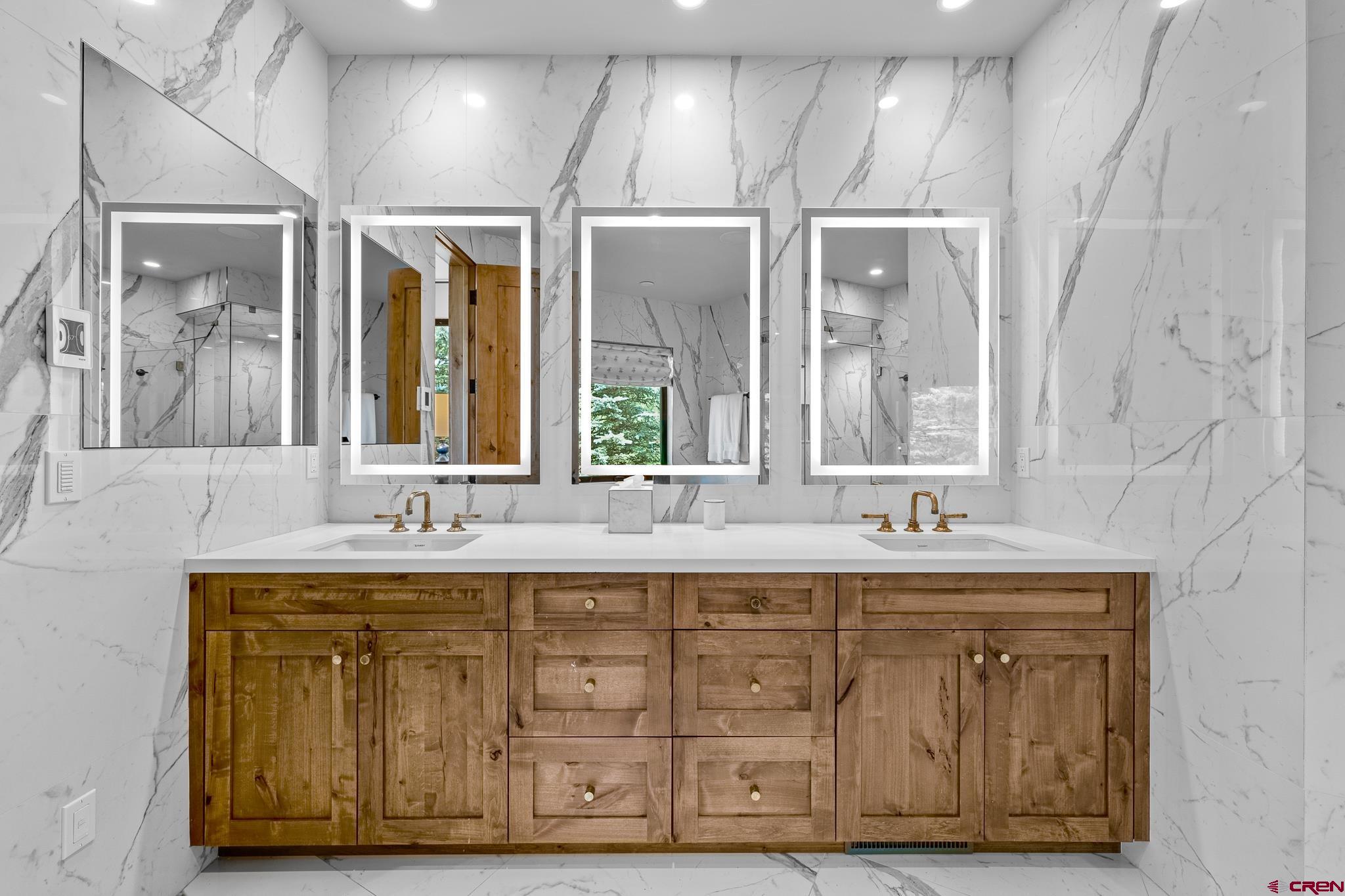 220 Hideout Trail Durango, CO 81301 - Photo 26 of 35 a bathroom with a double vanity sink and a mirror