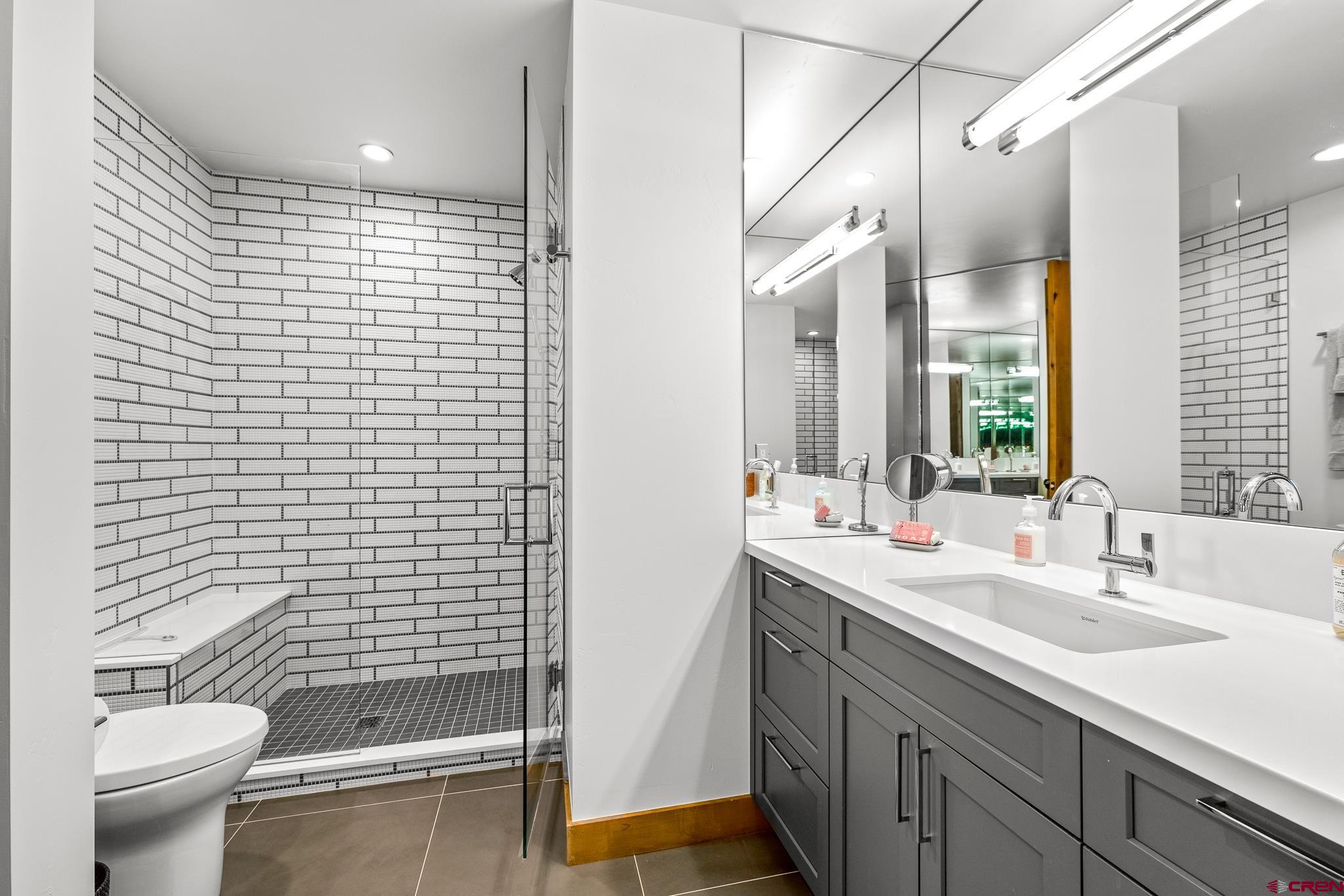 220 Hideout Trail Durango, CO 81301 - Photo 33 of 35 a bathroom with a sink a toilet and shower