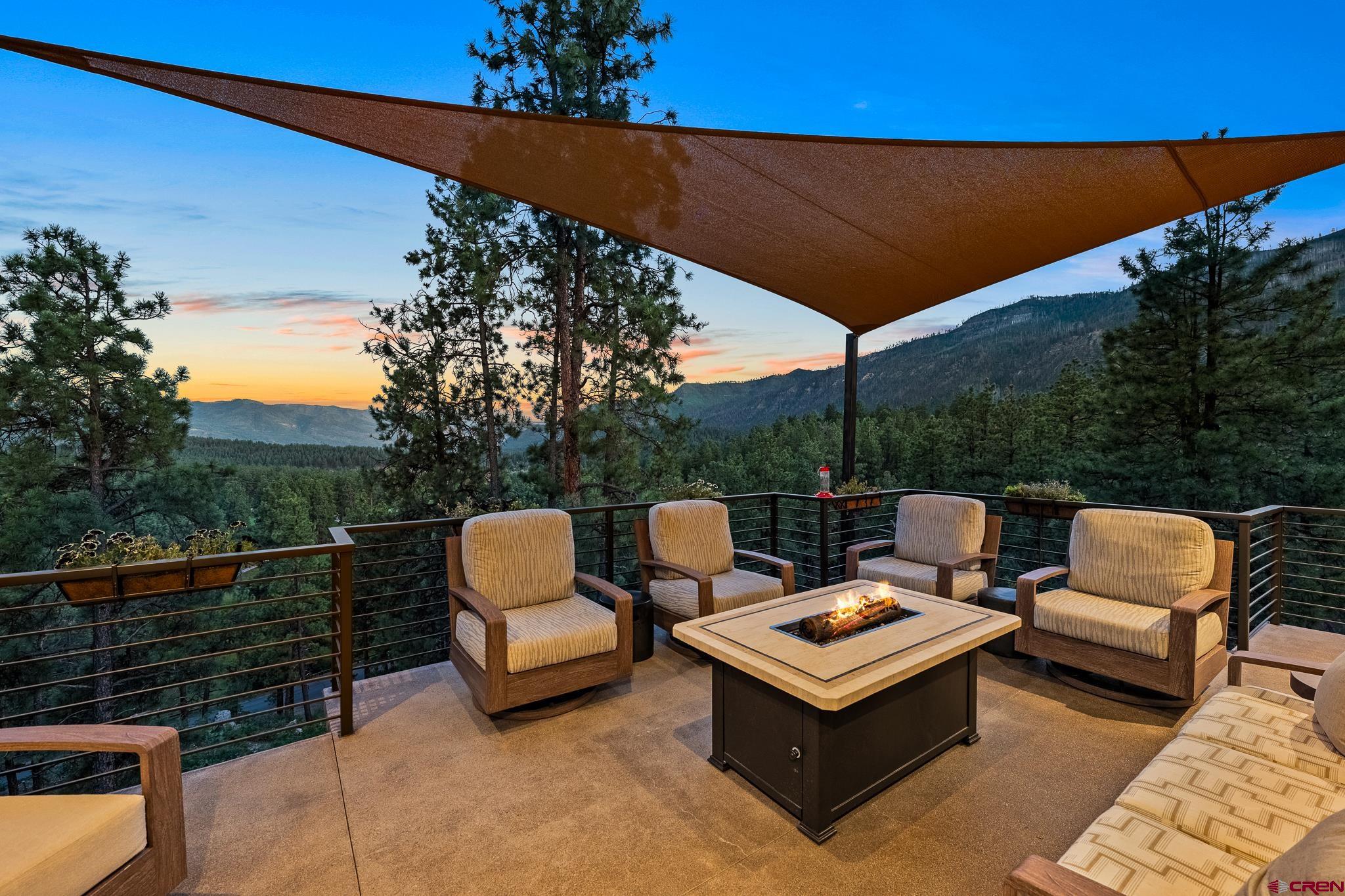 220 Hideout Trail Durango, CO 81301 - Photo 5 of 35 a backyard of a house with table and chairs