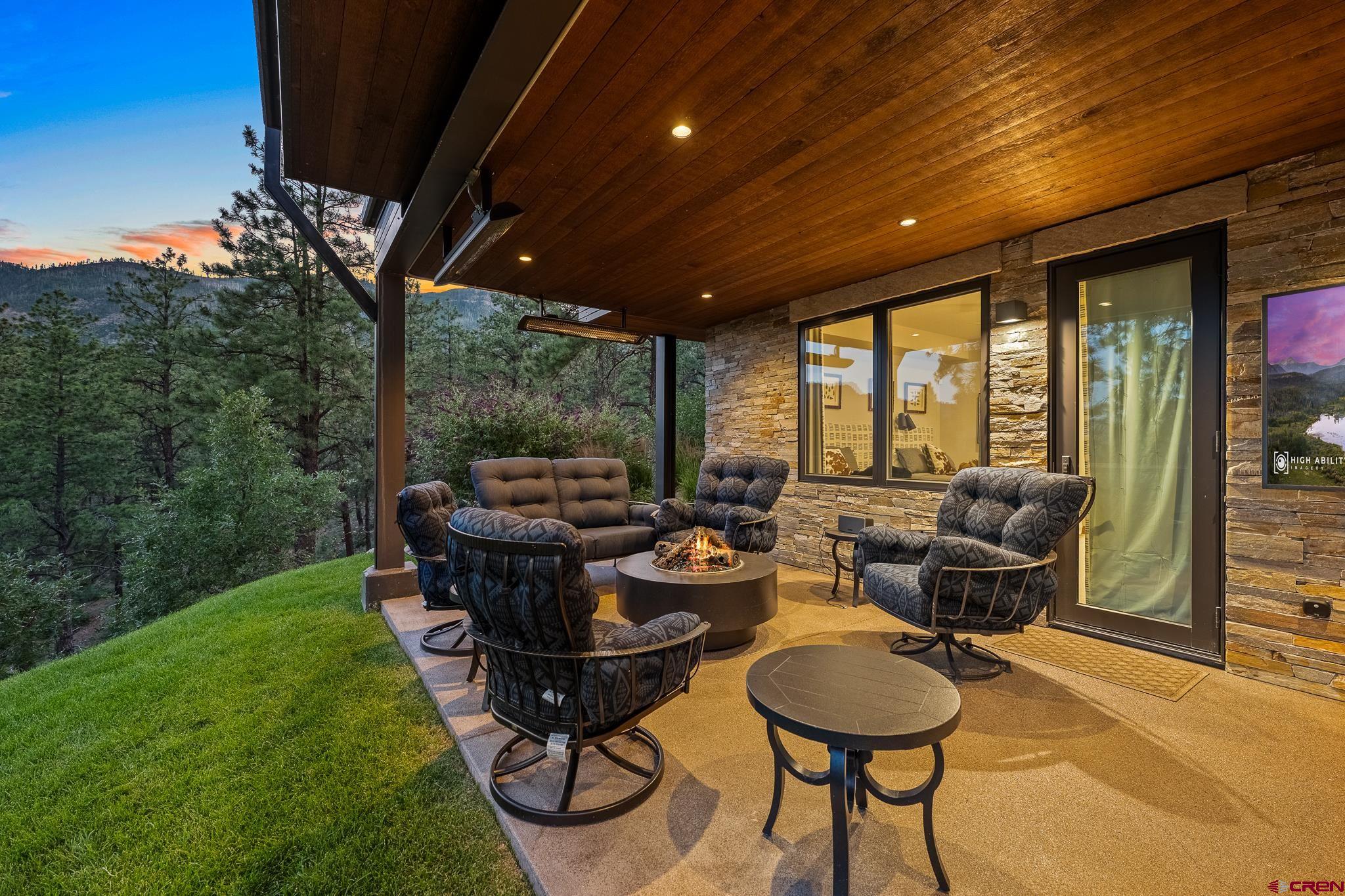 220 Hideout Trail Durango, CO 81301 - Photo 6 of 35 a backyard of a house with table and chairs