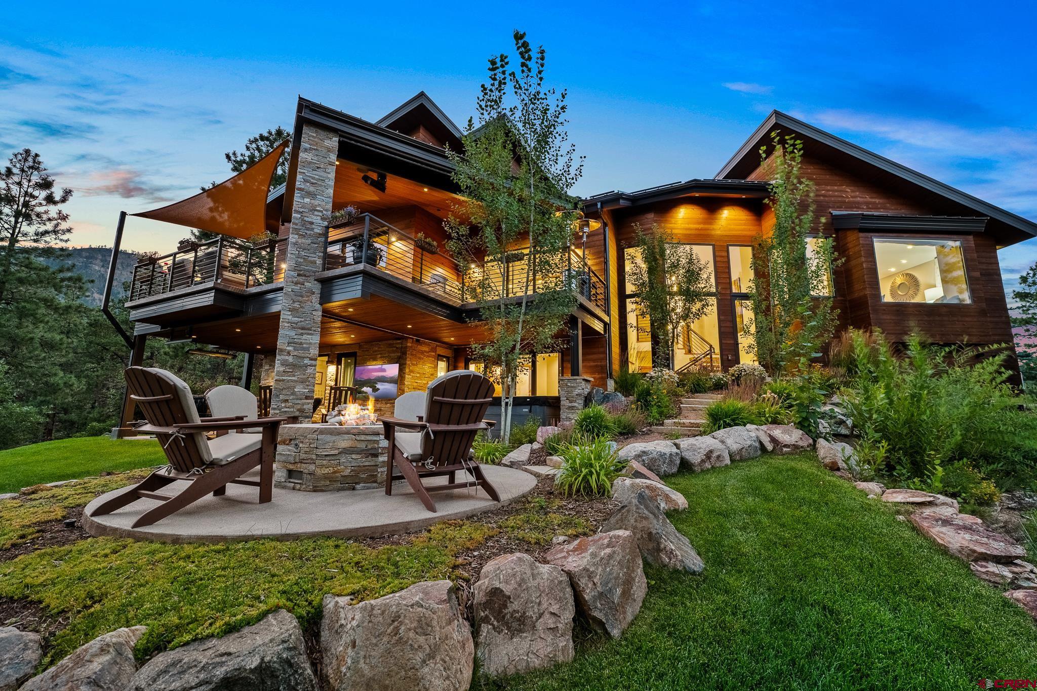 220 Hideout Trail Durango, CO 81301 - Photo 7 of 35 a view of a house with a yard porch and sitting area