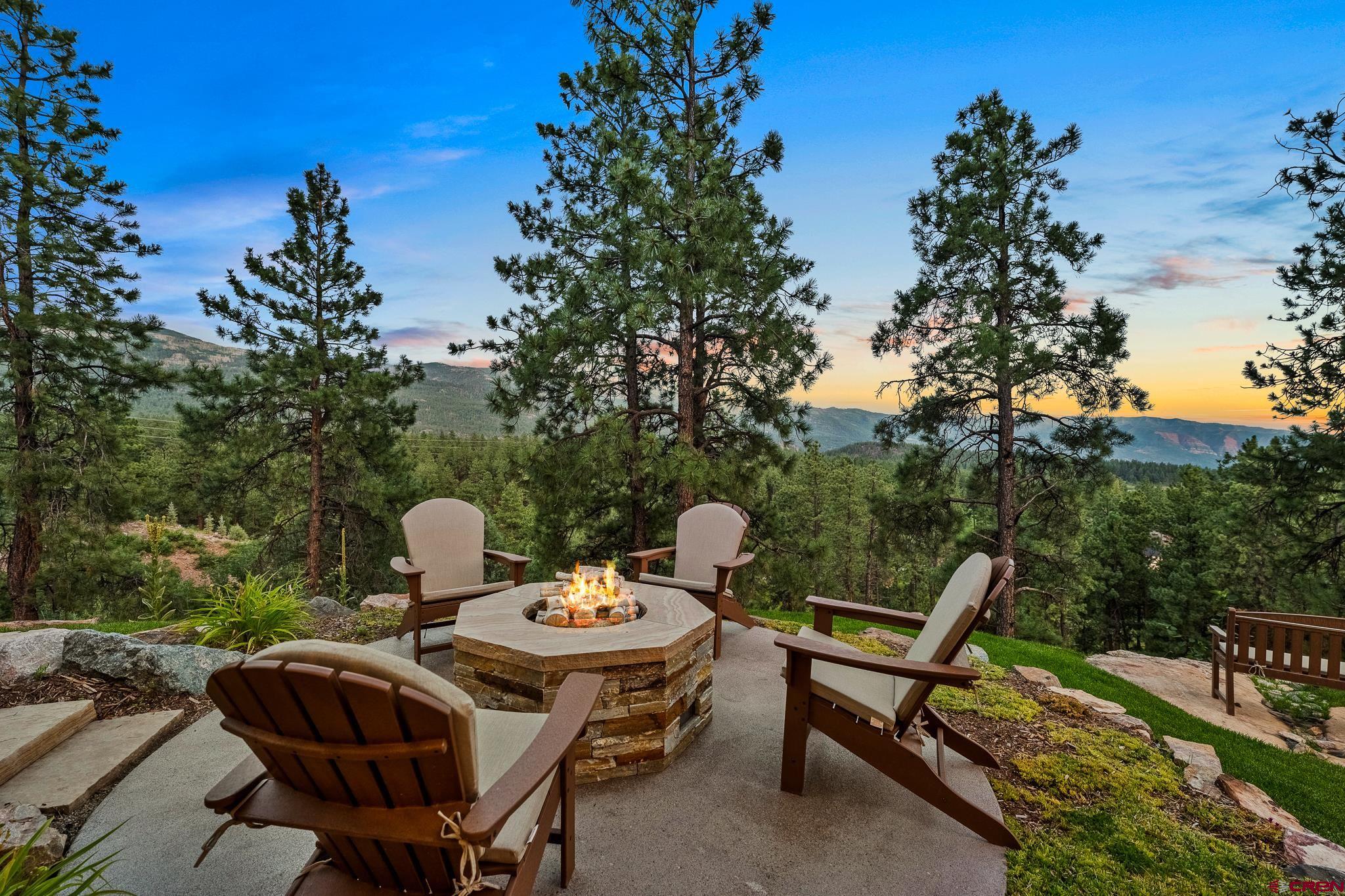 220 Hideout Trail Durango, CO 81301 - Photo 8 of 35 a backyard of a house with table and chairs