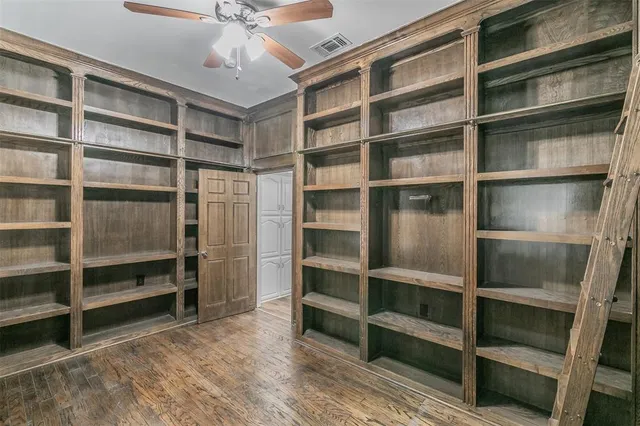 a view of an empty room with empty shelves