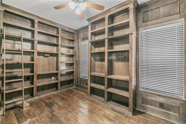 a view of an empty room with empty shelves