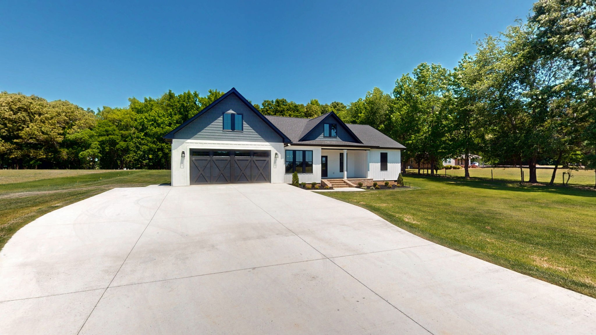 865 Alman Cemetery Road Paris, TN 38242 - Photo 33 of 41 a front view of a house with a yard and trees