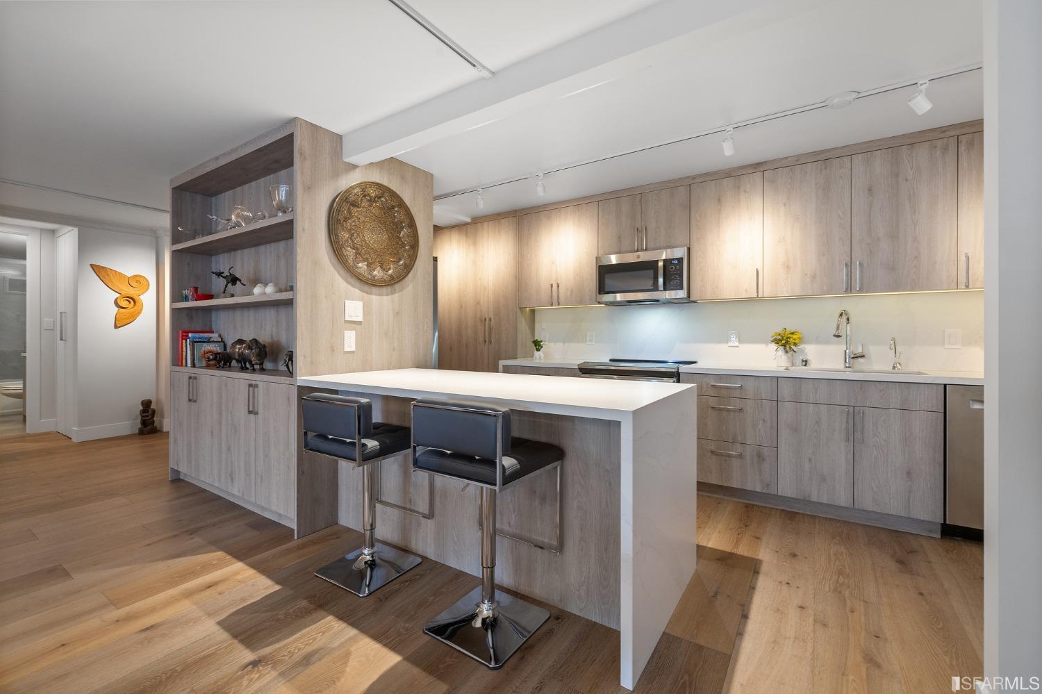 2200 Pacific Avenue, Unit 3A San Francisco, CA 94115 - Photo 11 of 57 a kitchen with a sink cabinets and window