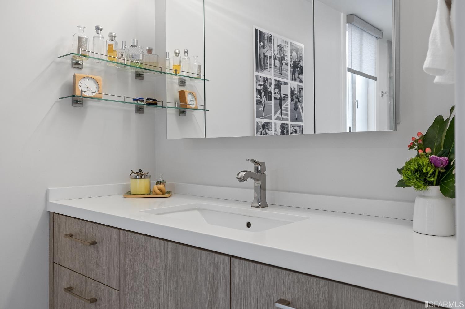 2200 Pacific Avenue, Unit 3A San Francisco, CA 94115 - Photo 23 of 57 a bathroom with a sink and a mirror