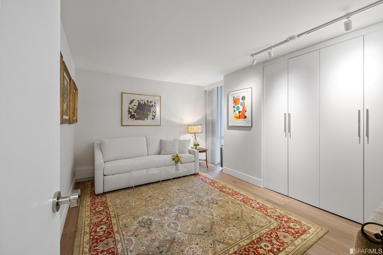 2200 Pacific Avenue, Unit 3A San Francisco, CA 94115 - Photo 27 of 57 a living room with furniture and a rug