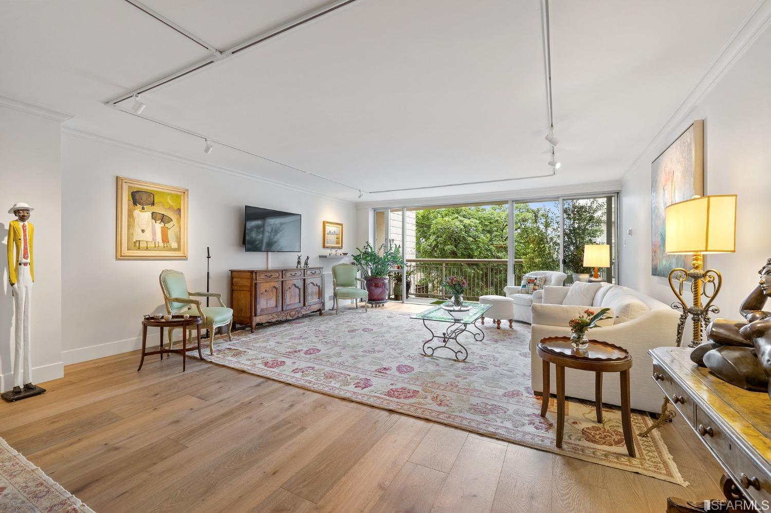 2200 Pacific Avenue, Unit 3A San Francisco, CA 94115 - Photo 31 of 57 a living room with furniture large window and wooden floor