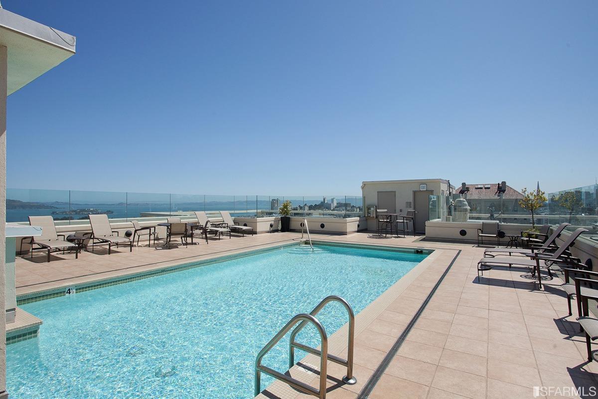 2200 Pacific Avenue, Unit 3A San Francisco, CA 94115 - Photo 48 of 57 a view of a swimming pool and lounge chairs
