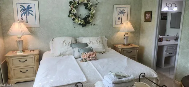 a bedroom with a bed and furniture