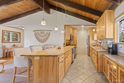 a large bathroom with a double vanity sink a mirror and a bathtub