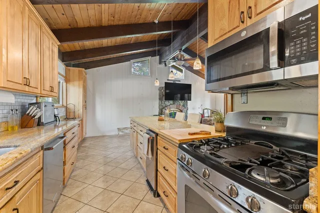 a kitchen with a stove and a sink