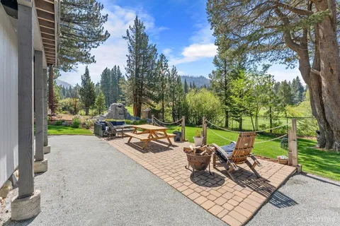 a view of a patio with chairs and a fire pit