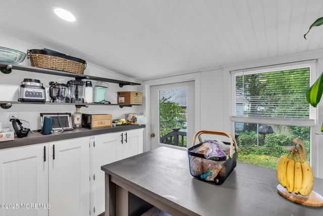 a kitchen with a sink cabinets and a window