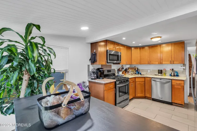 a kitchen with kitchen island granite countertop lots of counter top space