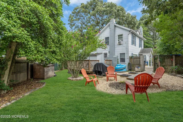 a view of balcony with outdoor seating and trees