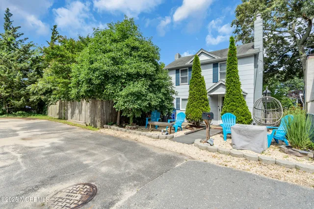 a building exterior with a table and chairs