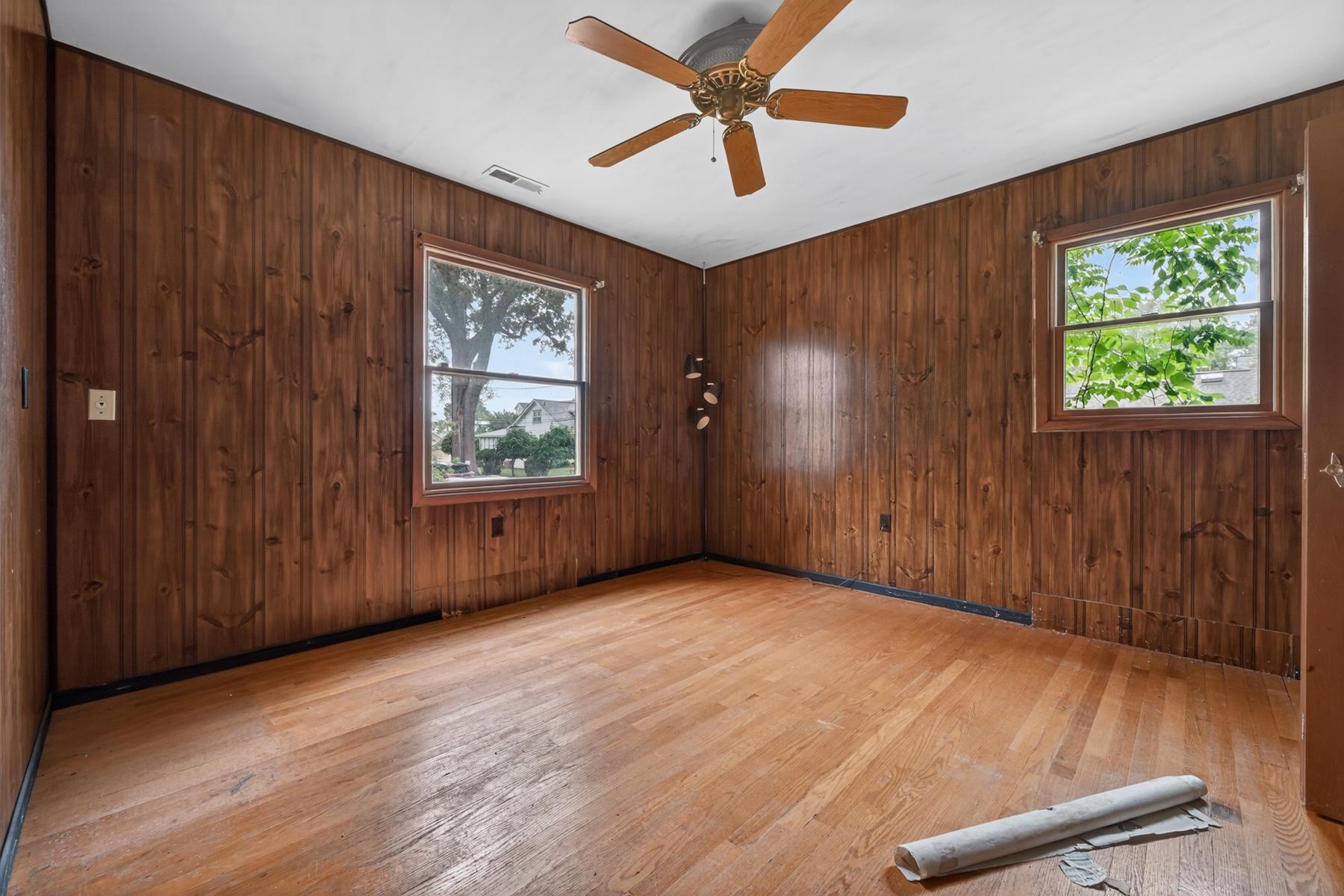 54 Decatur Avenue Annapolis, MD 21403 - Photo 13 of 63 an empty room with windows ceiling fan and hardwood floor