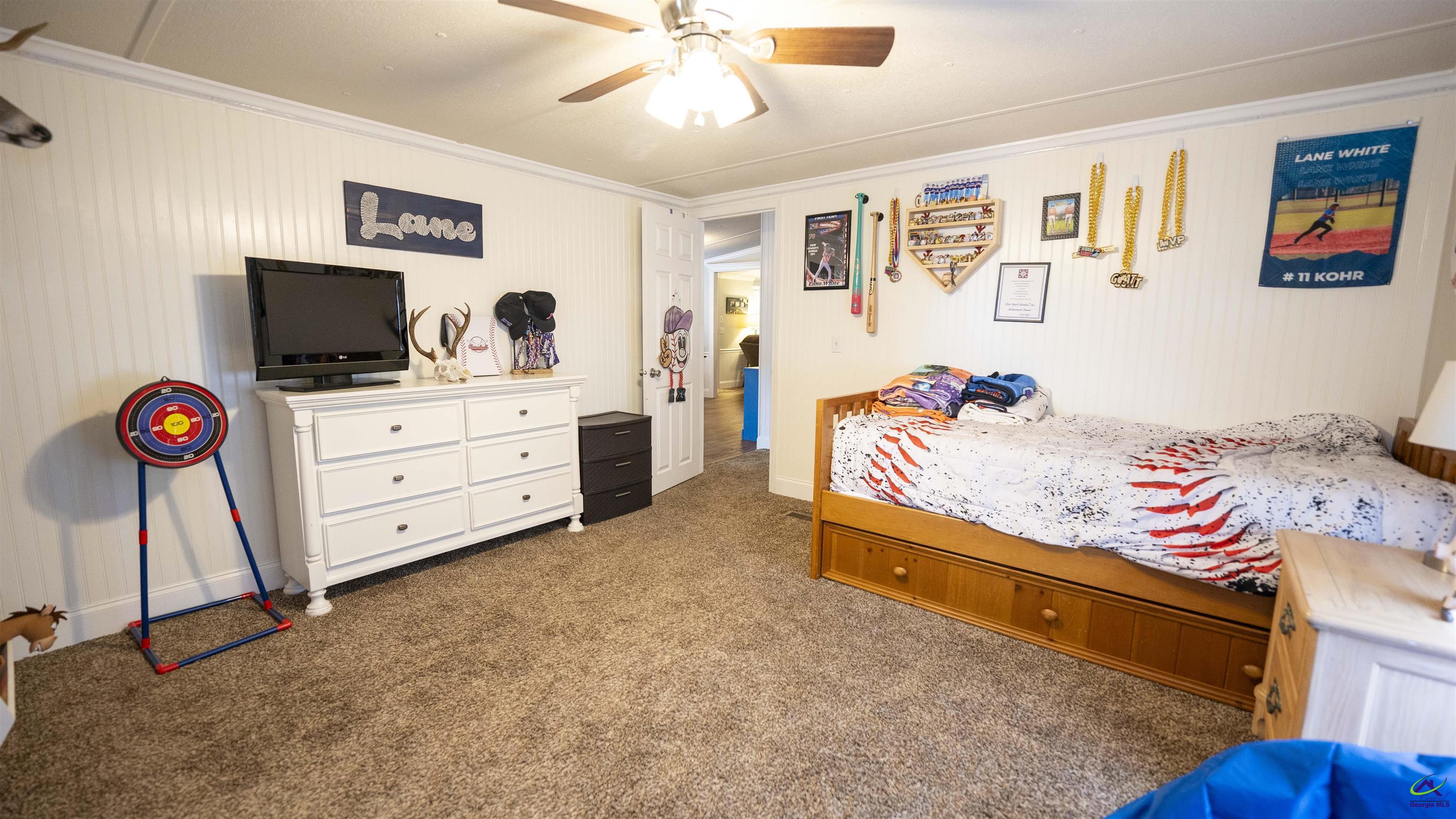 500 Old Milledgeville Road Cochran, GA 31014 - Photo 41 of 48 a bedroom with furniture and flat screen tv
