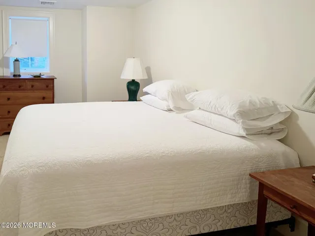 a large white bed in a white room
