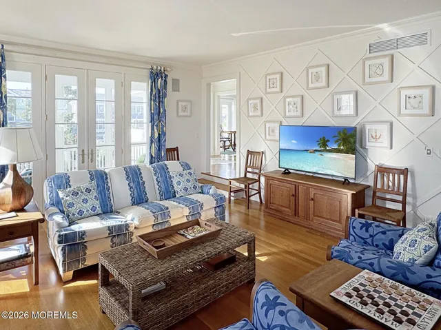 a living room with furniture a rug and a window