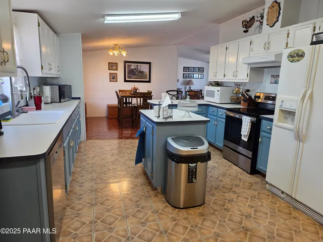 a bathroom with a sink a vanity and a mirror