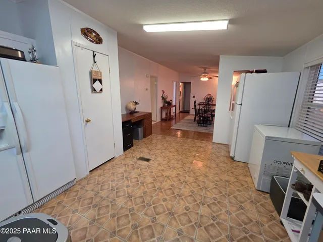 a bathroom with a sink a toilet a mirror and shower
